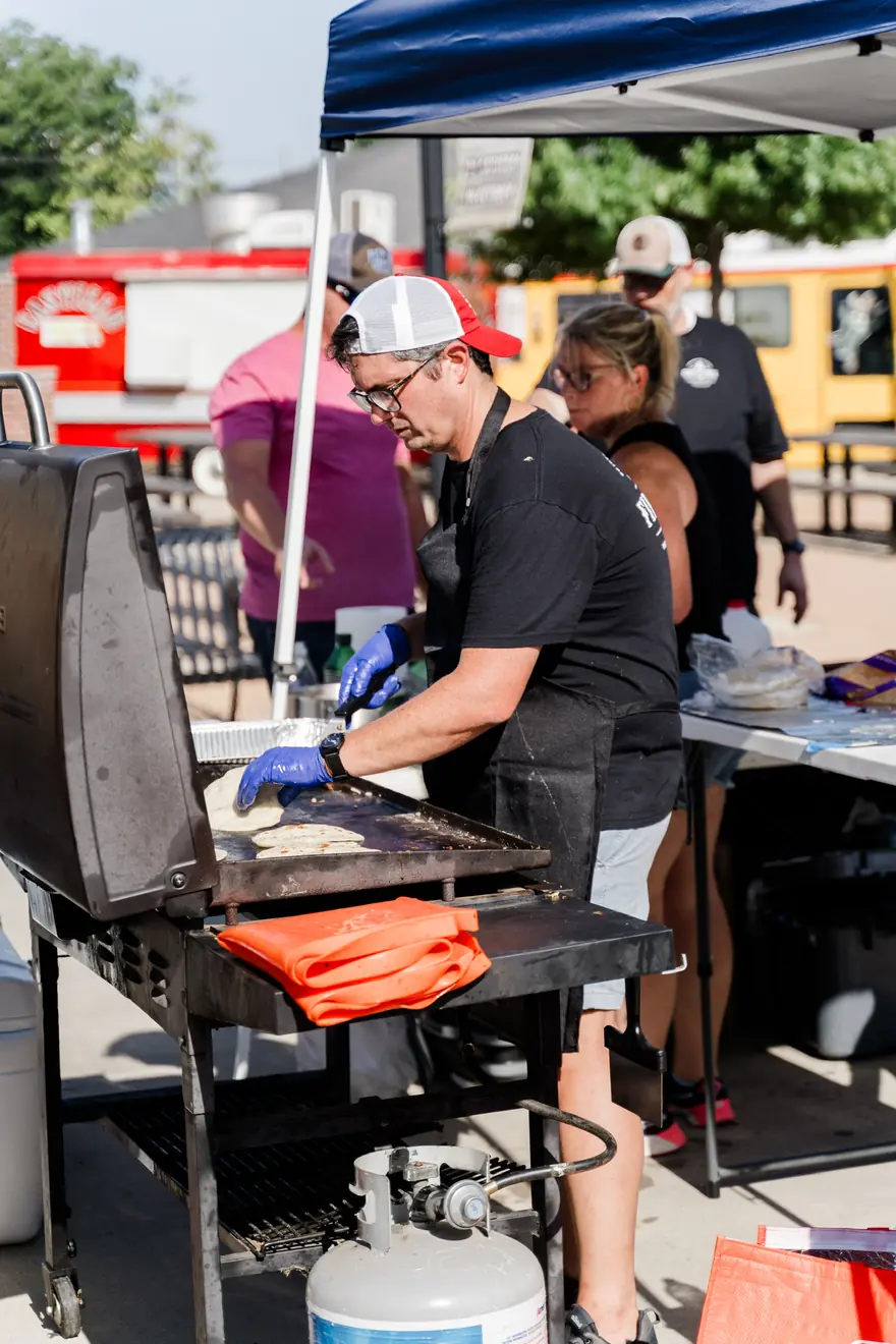 The Fire & Table crew working the grills at an event